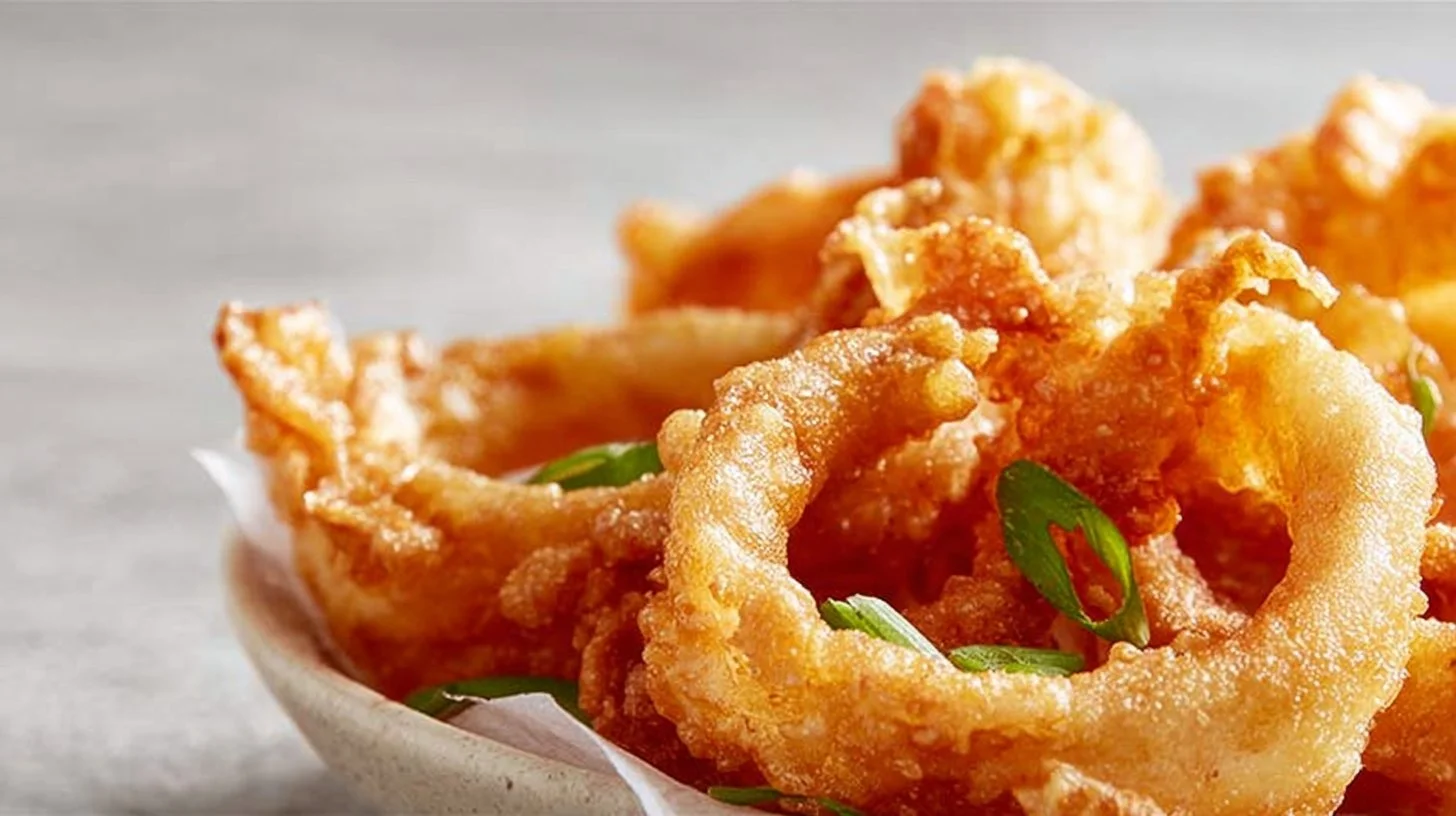 Crispy Crab Rangoon Onion Rings served with a dipping sauce
